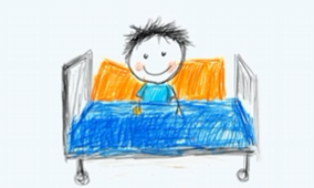 A child's drawing of a smiling child in a hospital bed